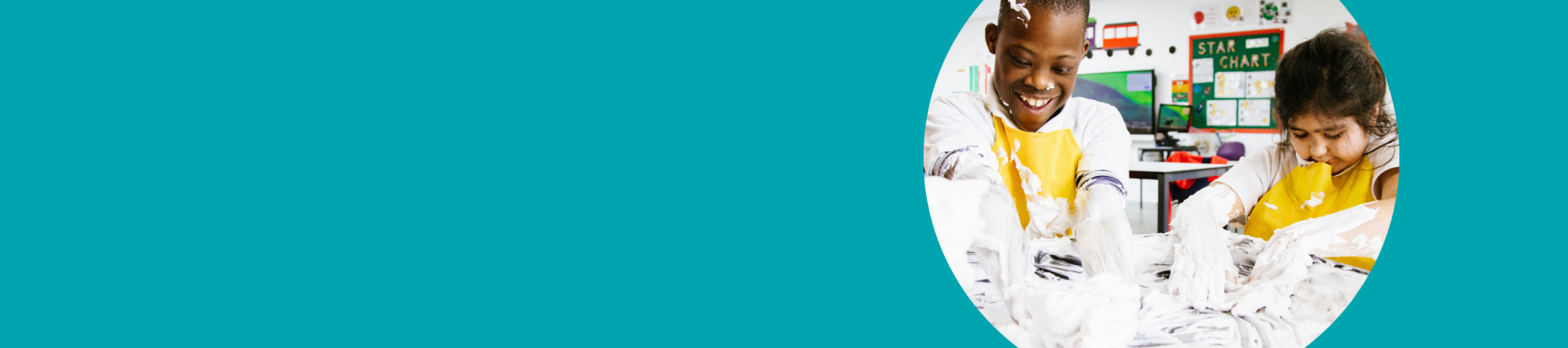 A teal banner with a photo of two children on the right with their hands in white paint, laughing